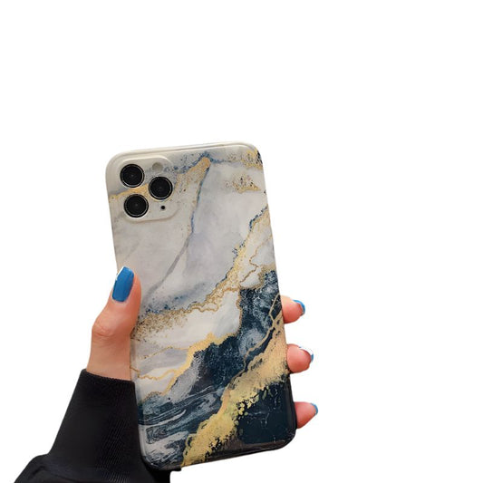 Phone case with marble design held by a hand on a white background